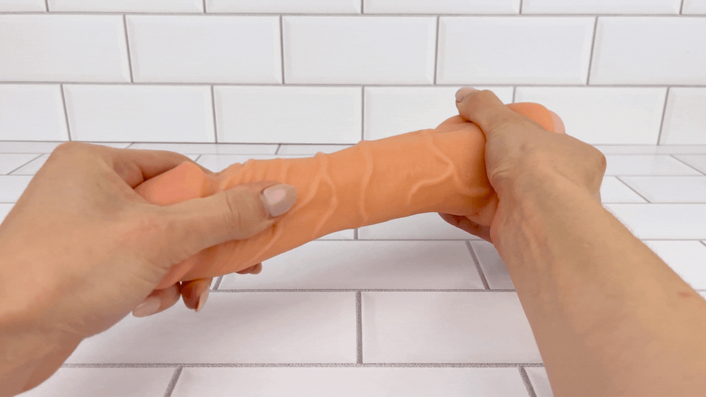 GIF of Penis Male Masturbator being stretched to demonstrate soft flexible texture 