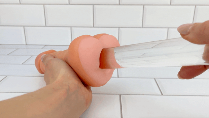GIF of glass dildo sliding into Penis Male Masturbator 