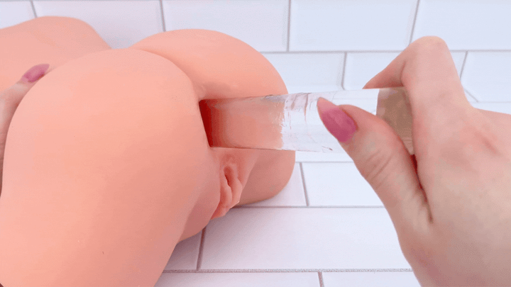 GIF of glass dildo sliding into anal entry of Lifelike Curvy Torso Masturbator 