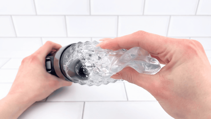 GIF of Automatic Vibrating Male Masturbator being squished soft jelly 