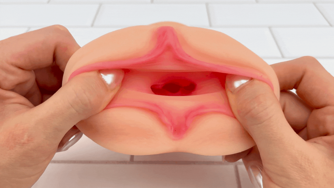 GIF of Dual Ended Stroking Sleeve - Tight Pussy opening being stretched to show textured interior 