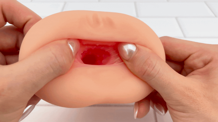 GIF of Dual Ended Stroking Sleeve - anal opening being stretched to show ribbed interior 