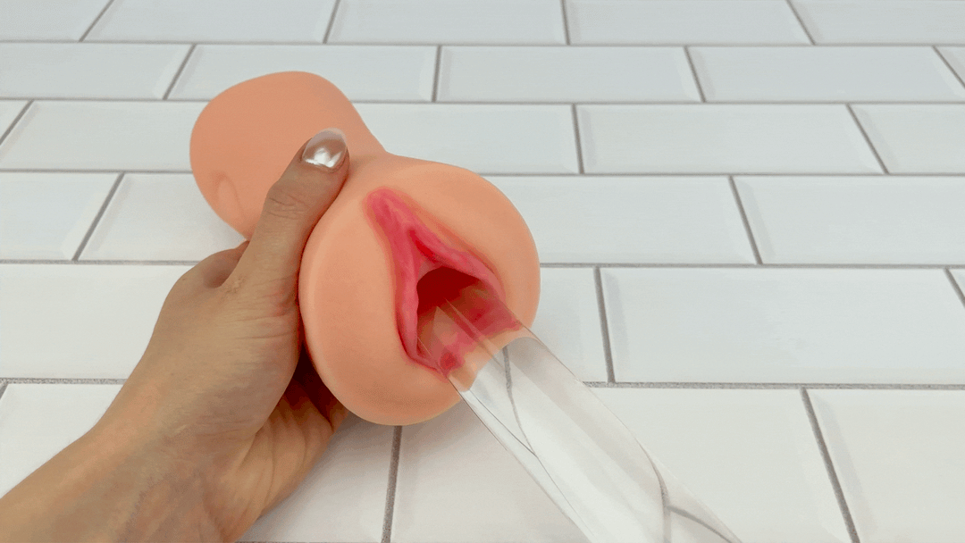 GIF of glass dildo sliding into Dual Ended Stroking Sleeve - Tight Pussy opening 