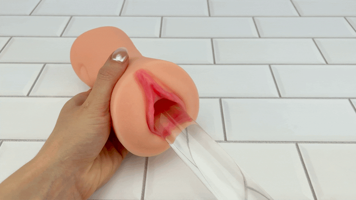 GIF of glass dildo sliding into Dual Ended Stroking Sleeve - Tight Pussy opening 