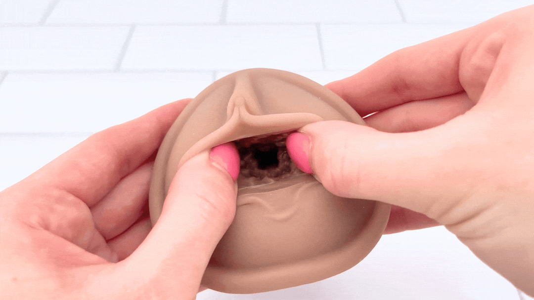 GIF of Realistic Pussy Stroker For Men being stretched open 