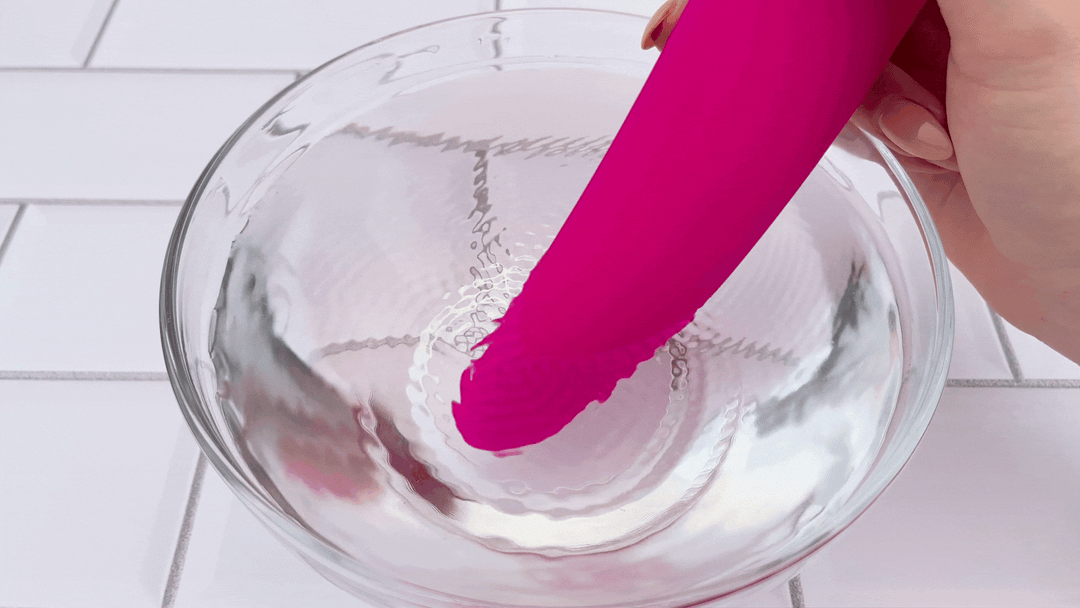 Dual-Ended Premium Clit Sucker and G-Spot Vibrator. G-spot shaft vibrating in bowl of water