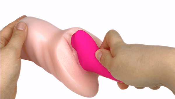 Toy inserted into a realistic pussy male masturbator