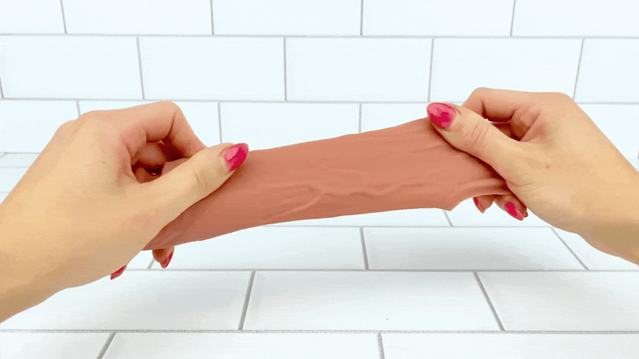 GIF of Real Feel Vibrating Penis Extender being stretched 