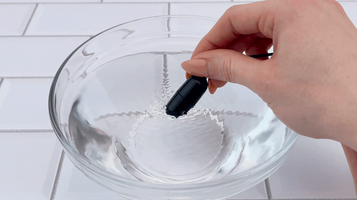 bullet frm Scrotum & Testicle Tension Dual Vibrating Cock Ring being stretched 