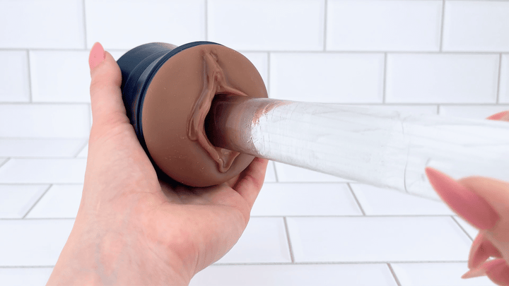 GIF of Dual-Ended Vibrating Masturbator glass dildo sliding into it 