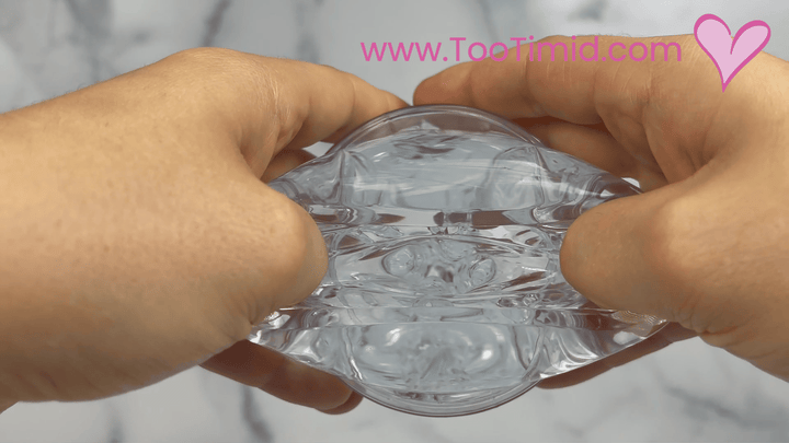 GIF of clear male masturbator in cup stretching inner sleeve