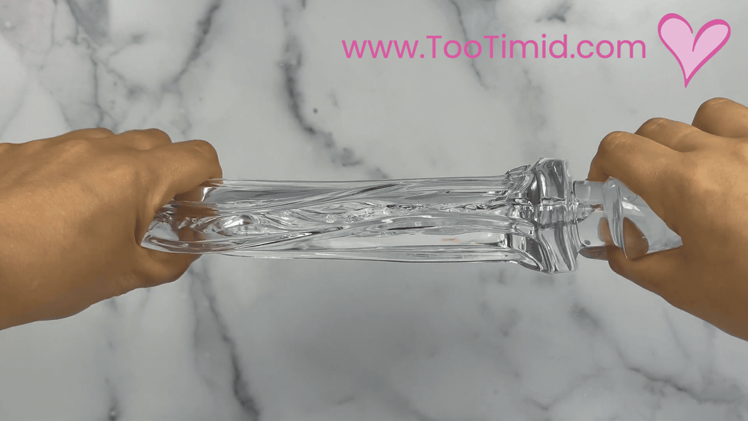 GIF of clear male masturbator out of cup stretching