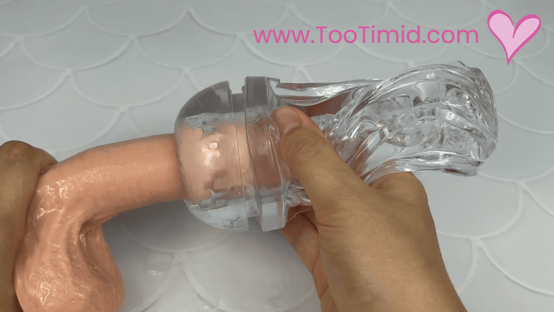 GIF of clear male masturbator out of cup stroking on beige dildo