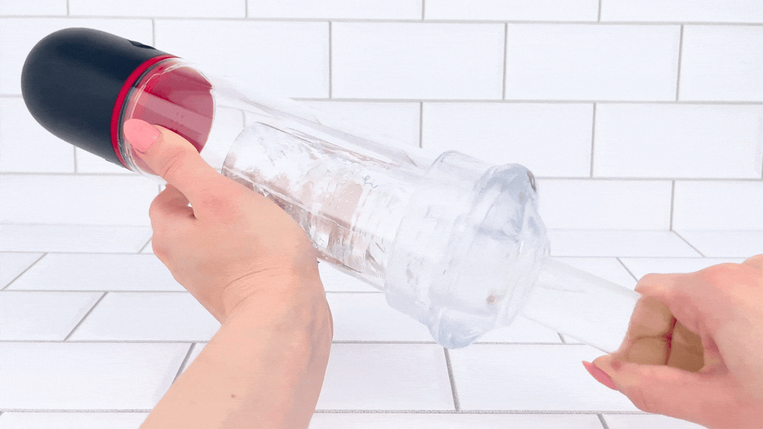 GIF of 3-in-1 Brotar Vibrating Penis Pump, Stroker, and Sucker glass dildo thrusting into it 
