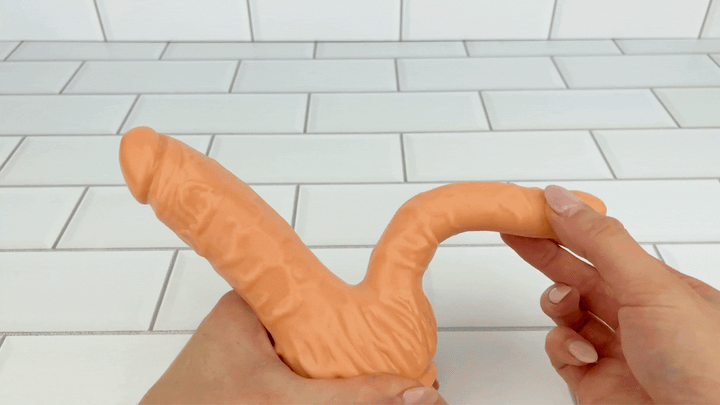 GIF of anal shaft from Clit Stimulating Dual Penetration Vibrating Dildo being bent 