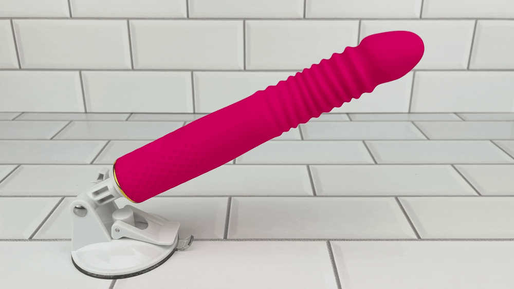 Thrusting and Vibrating Dildo with suction cup attachment in full motion 