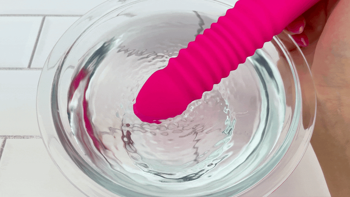 GIF Thrusting and Vibrating Suction Cup Dildo vibrating in bowl of water