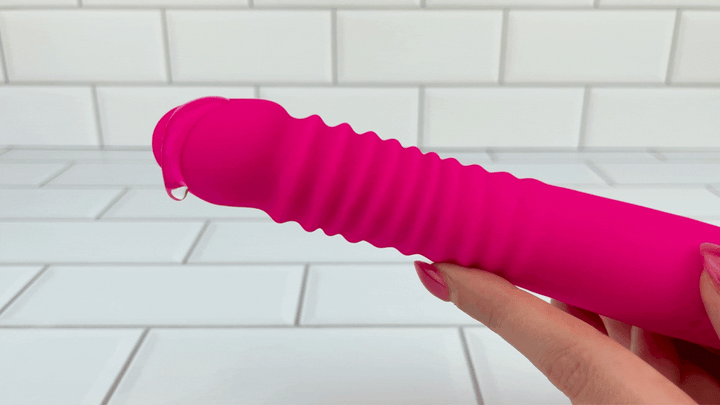 GIF of lube dripping off of Thrusting and Vibrating Suction Cup Dildo from powerful vibrations 