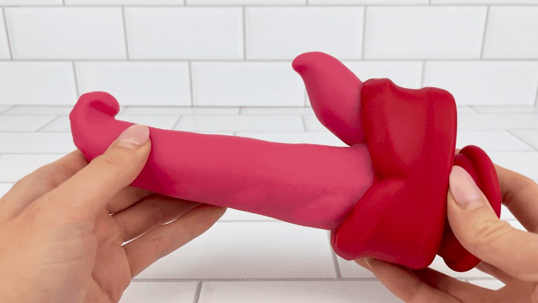 hands holding Dual-Action Thrusting & Rotating Tongue thrusting in motion 