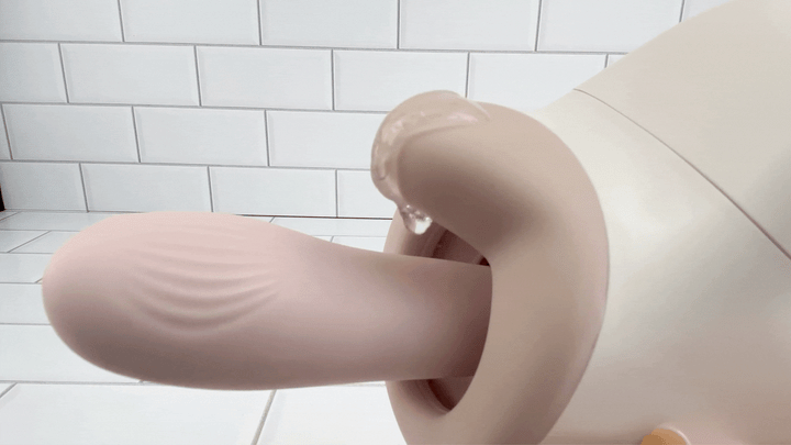 GIF of lube vibrating on top of clit stimulator from Automatic Thrusting and Vibrating Telescopic Sex Machine 