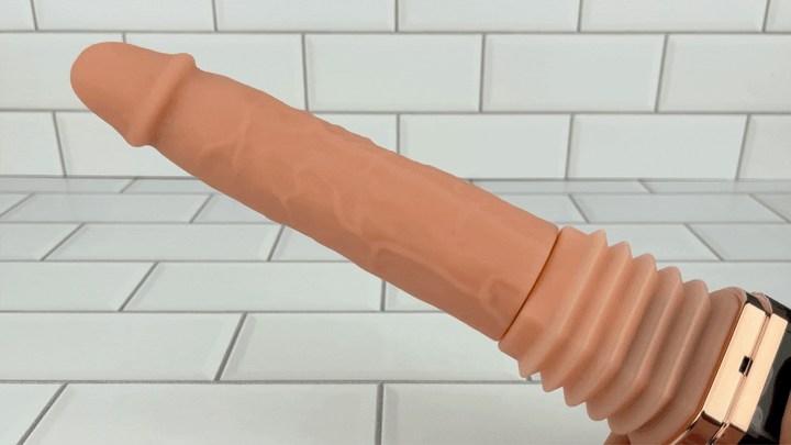 close up of Hands-Free Thrusting & Vibrating Silicone Dildo thrusting 