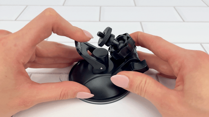 GIF of Hands-Free Thrusting & Vibrating Silicone Dildo base latch for suction being pressed down secured 