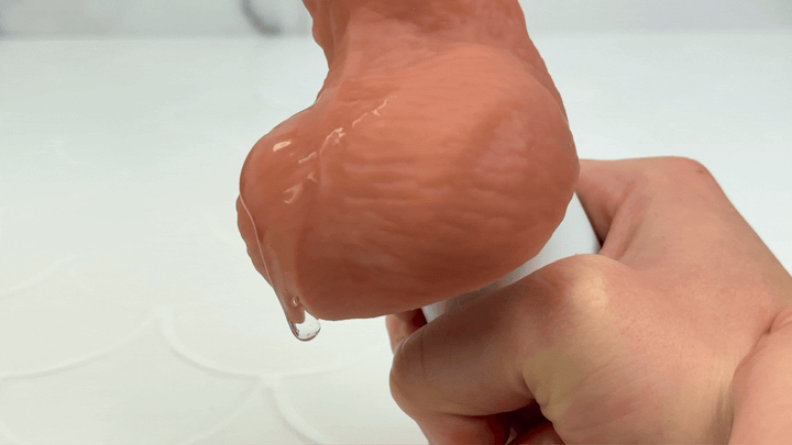 GIF of lube jiggling on balls of vibrating male masturbator 