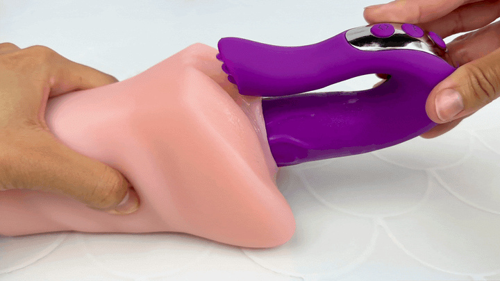 GIF of vibrator thrusting in and out of a model of a vagina