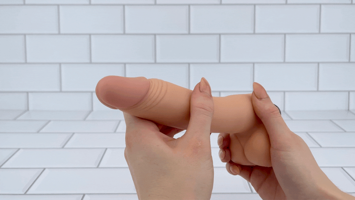 posable dildo being bent into shape GIF 