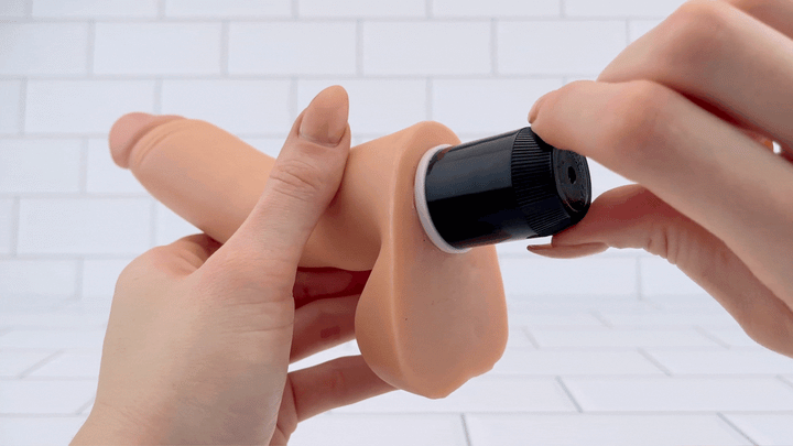 GIF of Vibrating Dildo with Balls  being turned on via multi speed dial 