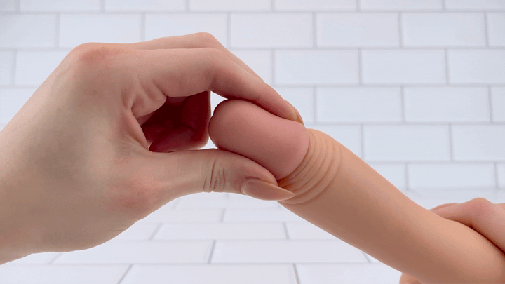 GIF of tip from Vibrating Dildo with Balls  being squished to show texture