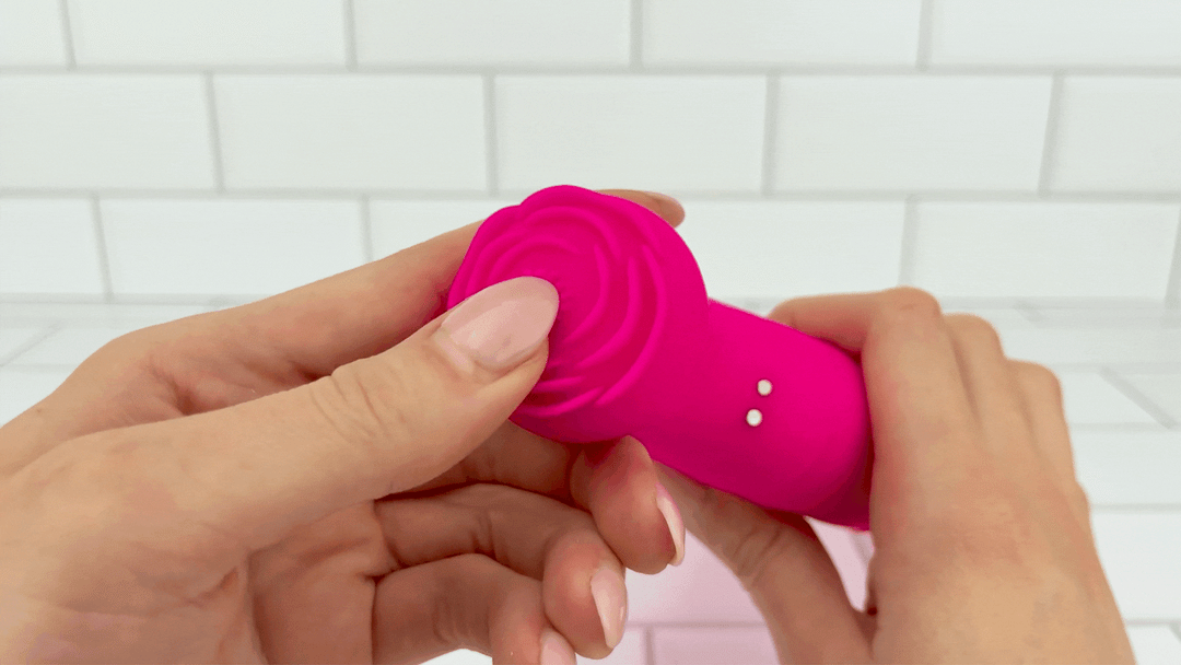 GIF of hot pink double penetration vibrator clit stimulating nub flower petals brushed soft silicone texture 