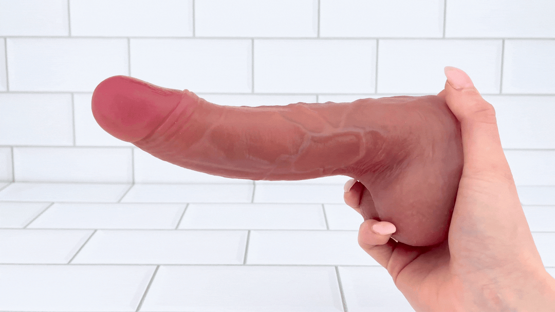 GIF of hand holding The Hot Shot Heated Thrusting and Vibrating Dildo