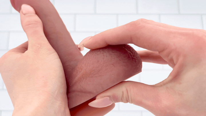 GIF of The Inferno Lover a Heated Thrusting and Vibrating Dildo balls being squished to show soft texture 
