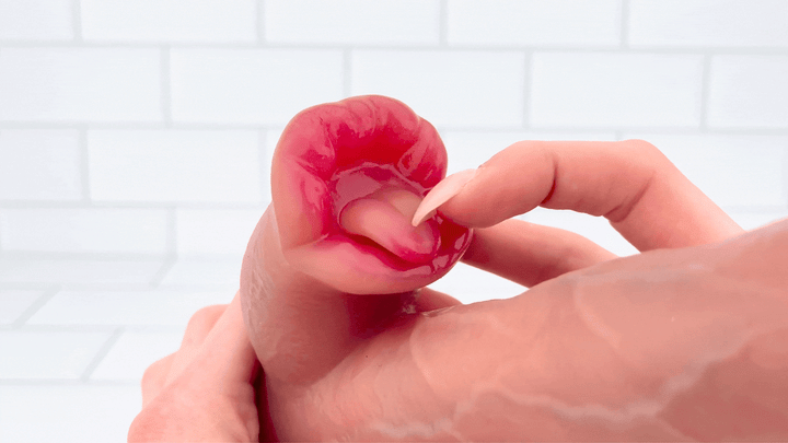 GIF of tongue being moved to show flexibility from Heated Thrusting and Vibrating Dildo with Clit Licker