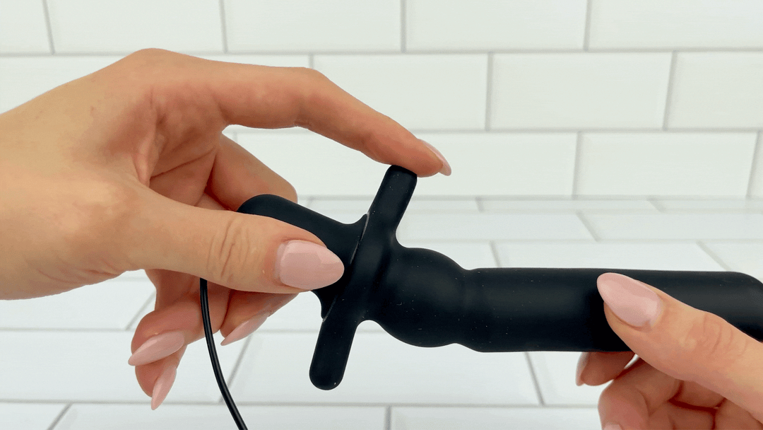 GIF of flared base being flexed to show soft texture from 7 Function Silicone Vibrating Prostate Massager 