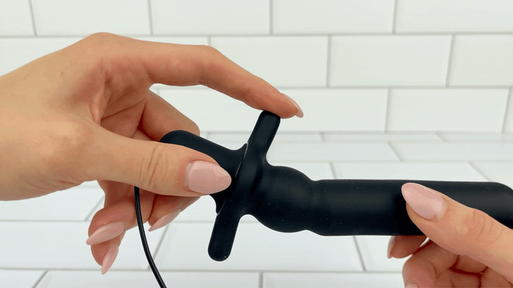 GIF of flared base being flexed to show soft texture from 7 Function Silicone Vibrating Prostate Massager 