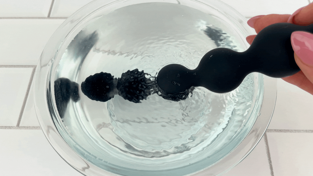 GIF of large vibrating anal beads as seen in bowl of water 
