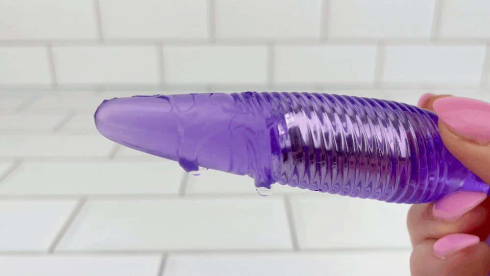 GIF of Vibrating Twister Butt Plug with lubricant vibrating and dripping off of Vibrating Twister Butt Plug by TooTimid 