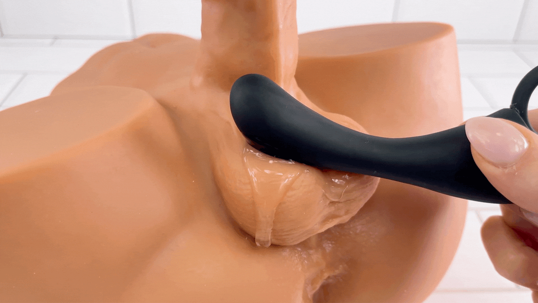 GIF of Dev's 10 Function Prostate Stimulator silicone vibrating against testicles 