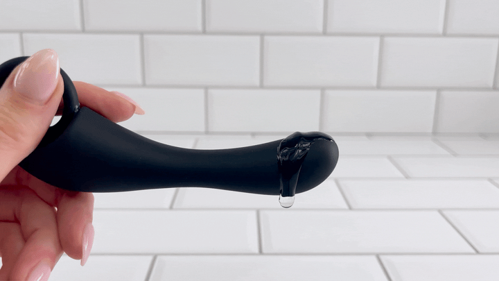 GIF of Dev's 10 Function Prostate Stimulator with lubricant vibrating off of tip