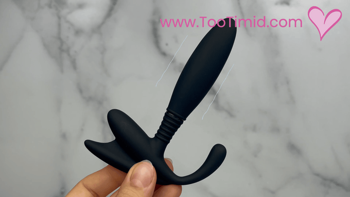 GIF of black prostate stimulator with remote showcasing vibration 