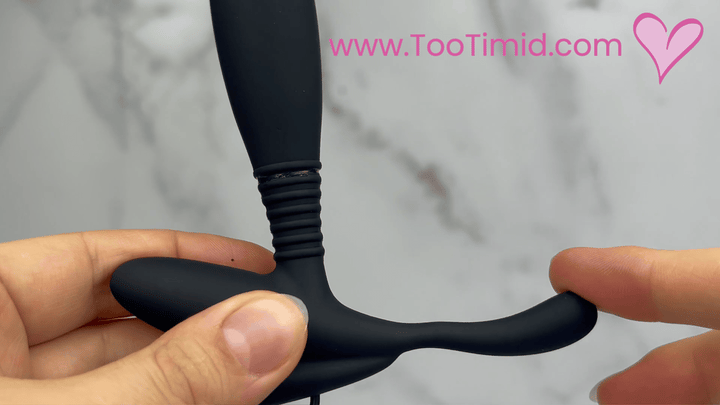 GIF of black prostate stimulator with remote showcasing taint tickler