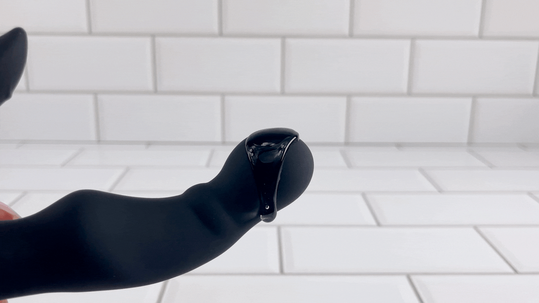 GIF of HIROKI Ultimate Wireless Rim Job Silicone Prostate Massager with lube vibrating off of bulbous tip 