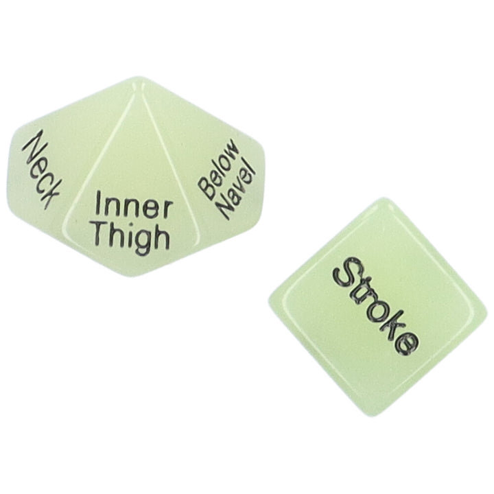 Bird's eye view of a pair of glow-in-the-dark sex dice showing the words "Stroke" and "Inner Thigh"