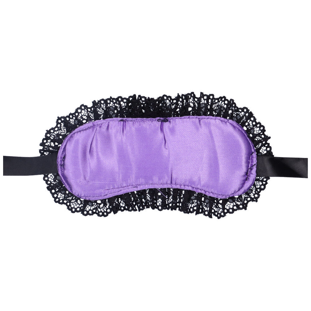 Bird's eye view of the bottom of a purple lace blindfold with satin straps.