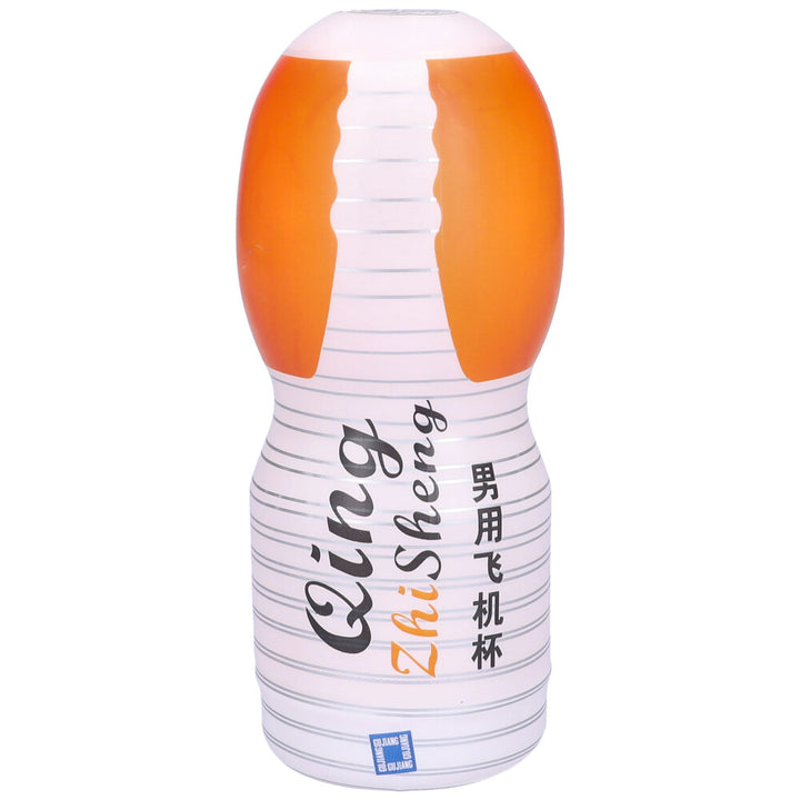 Front view of vagina masturbator cup in orange and white plastic wrapping.