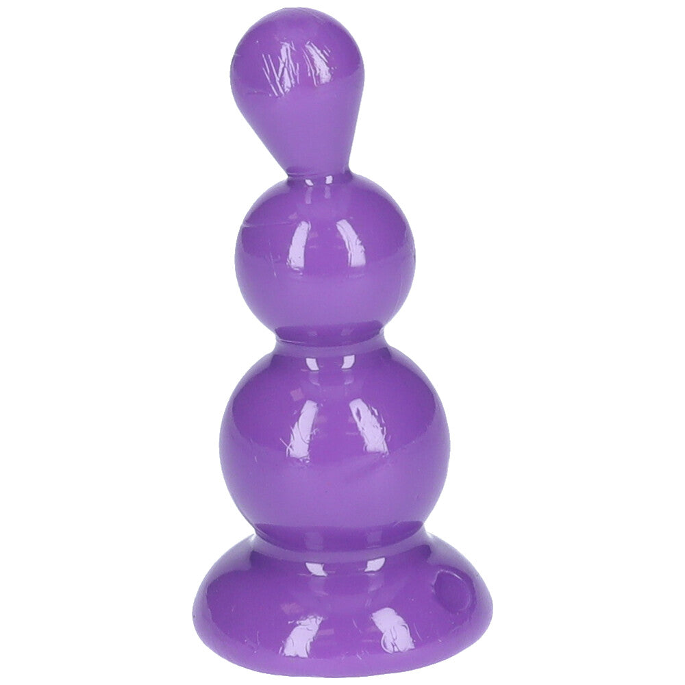 Front view of purple beaded anal plug with suction cup base.
