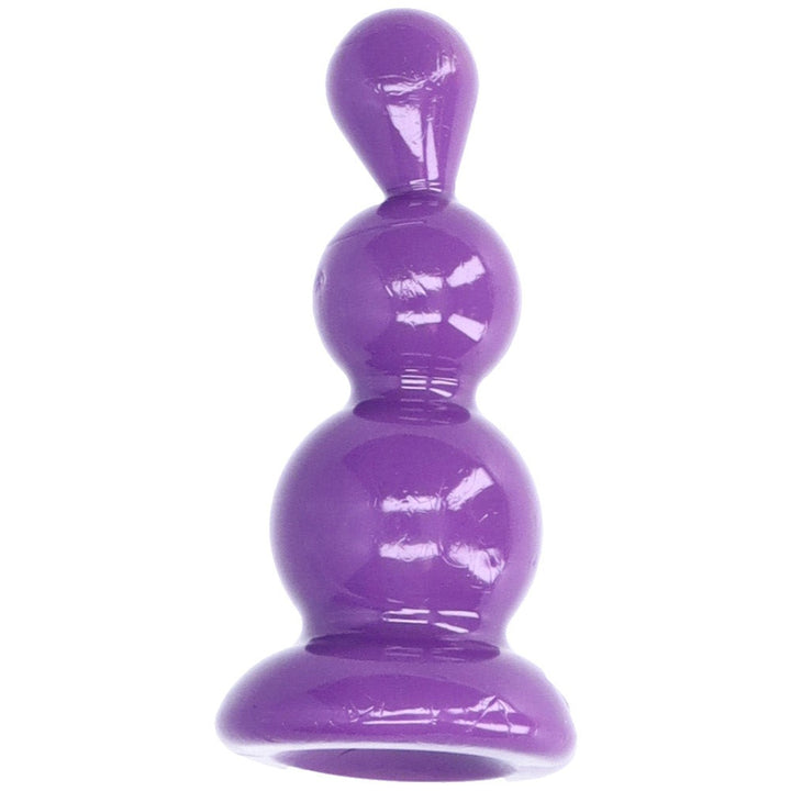Bird's eye view of purple beaded anal plug with suction cup base.