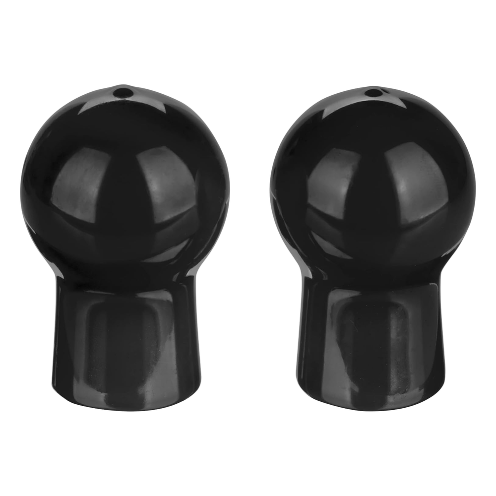 Two black nipple suckers on a white background